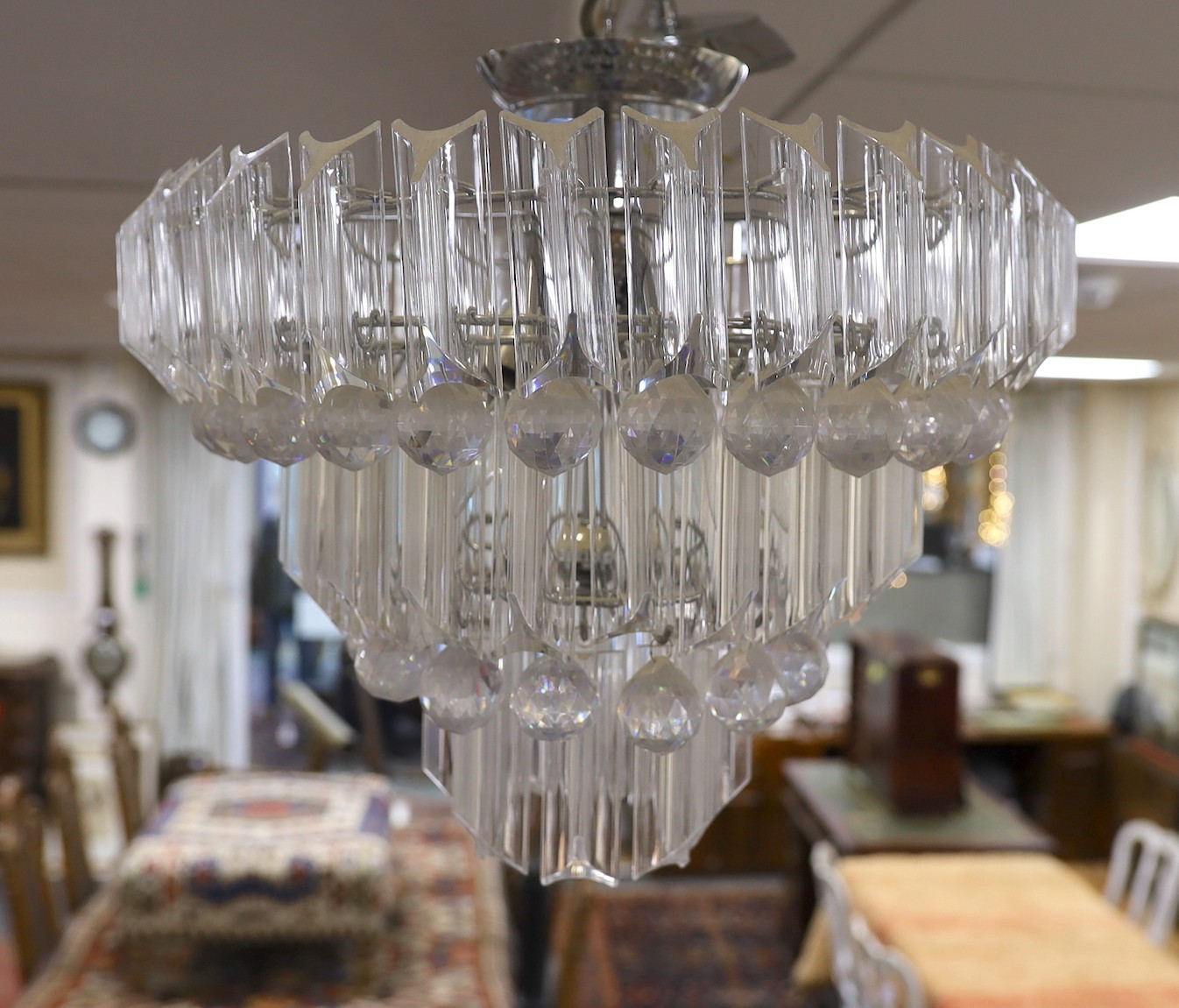 A perspex three tier chandelier